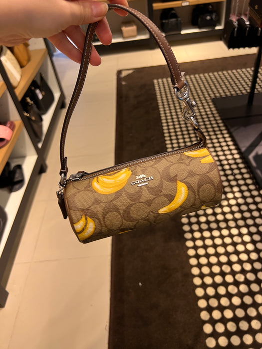 Coach Nolita Barrel Bag In Signature Canvas With Banana Print